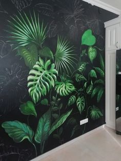 a black and green painted wall in a kitchen