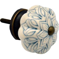 a blue and white knob with a flower design on it