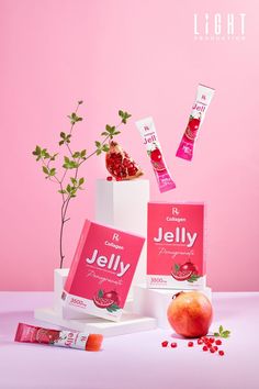 an advertisement for jely is shown on a pink background with pomegranates