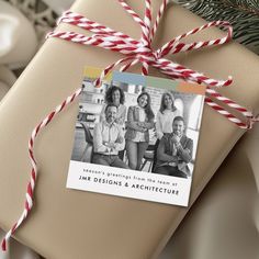 a present wrapped in brown paper with red and white twine