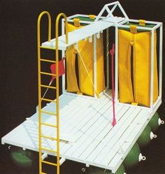 a small white structure with yellow doors and ladders