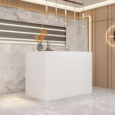 a white counter sitting in the middle of a room next to a wall mounted clock