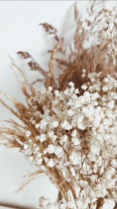 some white flowers are in a glass vase