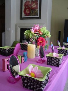 the table is covered with pink and green decorations