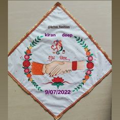 an embroidered banner with two hands holding each other