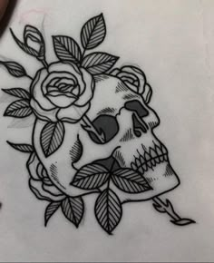 a drawing of a skull with roses on it