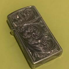 a lighter sitting on top of a green table