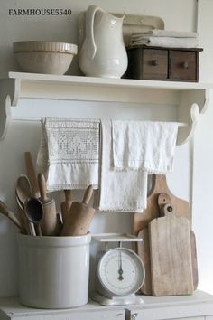 a shelf with various kitchen utensils on it