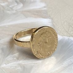 My icon This is a beautiful Emperor Alexander Severus brass coin ring. Alexander Severus was born in 208, in Phoenicia, and died in 235, in Gaul. Severus was emperor of Rome from A.D. 222-235. The coin is oxidized but the band is smooth and brilliant. (code-RK1493) © 2011 Artisanimpact Inc. All rights reserved. Construction & Dimensions: Brass. (PLEASE NOTE that brass may turn the skin green) Approximate diameter 16mm (0.63in). We can make any size, including quarter sizes. Please choose you Gold Brass Engraved Ring, Gold Coin-shaped Engraved Ring, Handmade Brass Signet Ring, Timeless Handmade Gold Rings, Gold Coin-shaped Engraved Signet Ring, Gold Engraved Coin Signet Ring, Vintage Brass Rings Tarnish Resistant, Vintage Tarnish Resistant Brass Rings, Vintage Brass Tarnish-resistant Rings