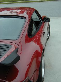 a red sports car parked on the street