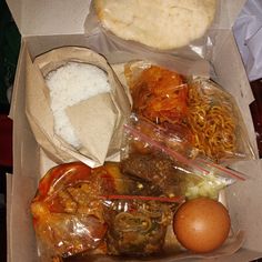 an open box filled with different types of food