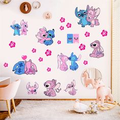 a room with pink and blue stickers on the wall, including little ponys