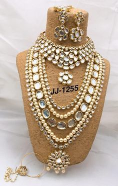 a necklace and earring set on display