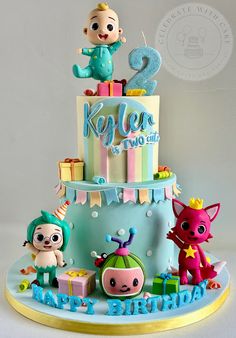 a birthday cake decorated with toys and decorations