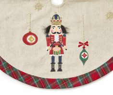 a christmas decoration with a nutcracker and ornaments