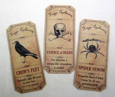 three tags with different types of spider and skull on them, one has a crow