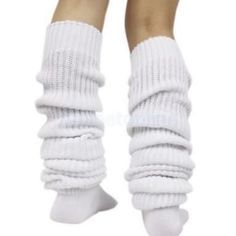 the legs and ankles of a woman wearing white socks