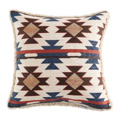 a decorative pillow with red, white and blue designs