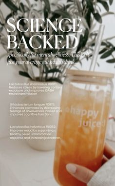 a person holding up a jar filled with liquid and the words happy juice on it