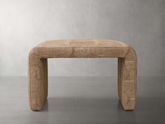 an upholstered bench made out of woven material