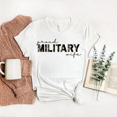 Proud Military Wife Shirt, Military Wife Gift, Military Family Shirt, Army Wife, Marine Wife, Navy Wife, Deployment Gift, Deployment Shirt This classic unisex jersey short sleeve tee fits like a well-loved favorite. Soft cotton and quality print make users fall in love with it over and over again. These t-shirts have-ribbed knit collars to bolster shaping. The shoulders have taping for better fit over time. Dual side seams hold the garment's shape for longer. - 100% Airlume combed and ringspun c Marine Girlfriend Shirts, Usmc Wife Shirt, Army Girlfriend Shirts, Proud Army Girlfriend, Army Mom Shirts, Military Mom Shirts, Camo Shirt, Marine Wife, Girlfriend Shirts