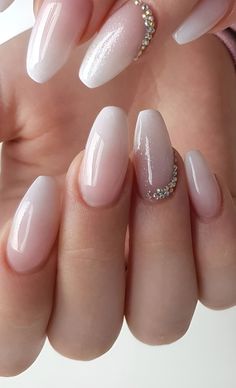 a woman's hand with some white and pink nails