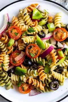 a white plate topped with pasta salad