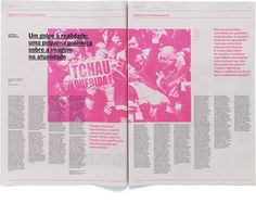 an open magazine with pink images on the front and back pages, in latin language