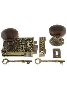 an assortment of door handles and knobs on a white background