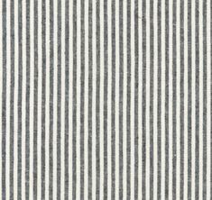 a blue and white striped fabric with a ruler in front of the stripe on it