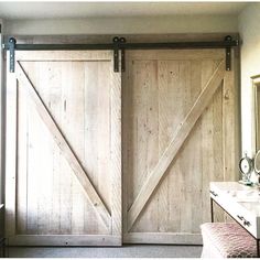 an open sliding barn door in a bathroom