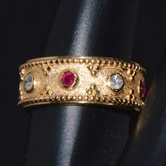 Gorgeous Natural 18k Solid Gold 0.29cts Diamond And 0.38cts Ruby Greek Ring. This Finely Crafted 18k Solid Gold Band Features Stunning Beaded, Textured Design Meticulously Made In Solid Gold And Accented With Four Round Brilliant Cut Diamonds Alternating With Four Round Cut, Vivid Red Rubies. There Is A Slight Patina In The Grooves And Edges Around The Design, Which Highlights The Design Even More. The Filigree Work Extends Around The Band. The Rubies Have A Deep Red Color And Weigh 0.38cts. This High Quality Ring Is Meticulously Made With Solid 18k Yellow Gold. Diamond Color : F-G Diamond Clarity : Vs The Round Cut Rubies Measures About 2.5mm. The Round Brilliant Cut Diamon Byzantine Gold, Byzantine Rings, Byzantine Jewelry, Greek Ring, Solid Gold Band, Deep Red Color, Textured Design, Diamond Color, Ring Band