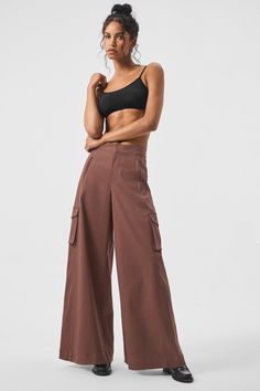 A cross between cargos and trousers, these pants are designed with exaggerated wide legs, cool cargo pockets and front zipper pockets. They’re made from a heavyweight, drapey cotton blend for a comfortable, put together look. The Show Off hits high on the waist (perfect for pairing with crop tops) with a tailored front and a stretchy back (for a fuss-free fit every time). Womens Onesie, Gray Accessories, Womens Capris, Knitwear Dress, Steel Grey, Wide Legs, Sweaters Knitwear, Alo Yoga, Yoga Clothes