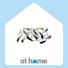 the logo for at home with arrows coming out of it