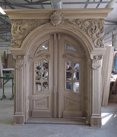 an elaborately carved wooden door in a building