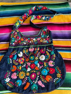 Beautiful Mexican embroidered bag !  Made of denim fabric. Bag is lined inside and has a small zipper  compartment inside.  All measurements are showing in all pictures please take a look before ordering.  If need to wash please only hand wash and hang to dry.  NO RETUNS OR EXCHANGES ON BAGS. Art Bags, Diy Purse, Art Bag, Embroidered Bag, Fabric Bag, Denim Fabric, Curvy Fashion, Cross Body Handbags