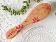 The perfect gift for any new baby to celebrate their birth, christening or naming day. Our bold and colourful retro flower styled baby hairbrushes are made from wood and have super soft goats hair bristles which are gentle enough to stimulate the scalp which can also help prevent cradle cap and soothe irritation. We'll add your chosen name whilst our mixed size flower design decorates each brush in shades of oranges and pinks. Natural non-toxic materials. The brush handle is made from wood, plea Cradle Cap, Traditional Toys, Personalized Newborn, Personalised Baby, Christening Gifts, Retro Flowers, Baby Hair, Newborn Gifts