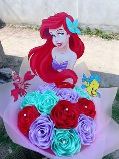 the little mermaid bouquet has been made out of paper and is ready to be placed on display