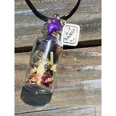 5mm Glass Bottle With Cork Features Tarot Card Charm As Pictures And Purple Wax On Top. Inside Of The Jar Are Mugwort, Black Tea Leaves, Oolong Tea Leaves, Rose Petals, Angelica Root, Moonstone, Amazonite, Lapis Lazuli, Clear Quartz, And Black Tourmaline. All Herbs And Crystals Are Said To Help Your Own Intuition Become More Active. This Helps In Life And Divination Too! As Per Etsy Policy These Items Are For Entertainment Purposes. Necklace Is Available In 18” Black Cord Or 22” Stainless Steel Spell Jar Necklace, Jar Necklace, Angelica Root, Car Mirror Charm, Black Tea Leaves, Diamond Drop Necklace, Amber Bead Necklace, Spell Jar, Glass Bottles With Corks