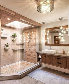 a bathroom with a walk in shower next to a sink