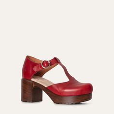 Meet our T-strap clog shoe, crafted from vibrant clear red leather in Portugal.  stands out with its bold color and classic design. Set on a sturdy cushioned platform, Kerstin offers both style and comfort. The T-strap provides a secure fit and an elegant touch, making it the perfect choice for adding a pop of color to any outfit. Heel 7.5 cm / 2.95 in Soft, flexible lightweight sole Leather lined Normal fit Clog Shoe, Clogs And Mules, Heel Grips, Shoes Too Big, Naha, Bold Color, Slipper Shoes, Clogs Shoes, Design Set