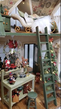 a doll house with a ladder and christmas decorations