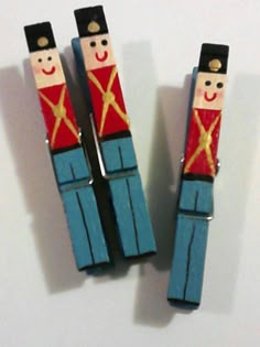 two wooden nutcrackers sitting next to each other