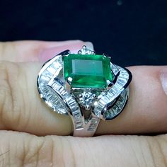 MADE TO ORDER ITEM. Takes 7 business days to complete. ENJOY OUR WORRY-FREE SERVICE AND THE DAZZLING, GENUINE JEWELRY WE DESIGN AND HANDCRAFT WITH LOVE❤️ ABOUT THE ITEM: EXTREMELY VIVID, Certified, JUMBO 4.73 total carats weight, Emerald ring. The ring was handmade and designed uniquely! Very elegant! Would be the perfect gift for your loved one, or as an engagement ring! Free ring sizing. Free return! CUSTOM-MADE RING, PERFECTLY HANDCRAFTED TO FIT THE ENCHANTING, VIVID EMERALD SUGGESTED RETAIL Formal Moissanite Emerald Ring, Elegant Hallmarked Baguette Cut Emerald Ring, Art Deco White Gold Emerald Ring For Formal Occasions, Exquisite White Gold Baguette Cut Emerald Ring, Vintage Emerald Rings, Famous Jewelry, Handmade Gold Ring, Emerald Ring Vintage, Diamond Pendants Designs