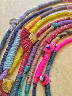 several colorful bracelets are laid out on the floor