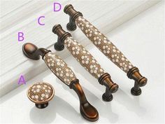 four different types of decorative knobs and handles