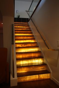 the stairs are lit up with yellow light