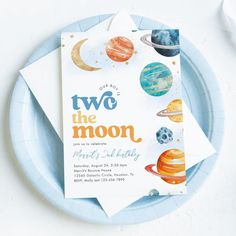 two paper plates with napkins on top of them and the words, two the moon