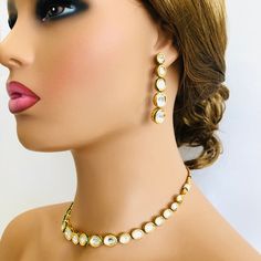 Bridal Kundan Necklace/Golden Meenakari Necklace/Kundan neckace/Indian/Pakistani/Wedding/Bollywood/Traditional/Kundan/Meenakari Jewelry Features 1-Traditional Kundan/Polki/Meenakari Necklace Set 2-Handcrafted To Perfection 3-Unique boutique design 4-A Beautiful & Memorable Gift for Weddings and Special Occasions 5-Earrings: 2.25 Inches ------------------------------------------------------- Click here for see more designs in our Kundan Necklace Sets and Jewelry Collection: https://www.etsy.c Kundan Jewelry Sets With Cutdana, Eid Round Kundan Temple Necklace, Round Kundan Necklace With Meenakari, Ceremonial Kundan Jewelry Set With Meenakari, Gold Kundan Necklace With Stone Work, Bollywood Kundan Necklace, Gold Kundan Necklace With Cutdana For Eid, Gold Kundan Necklace With Stone Work For Eid, Festive Kundan Necklace As Gift