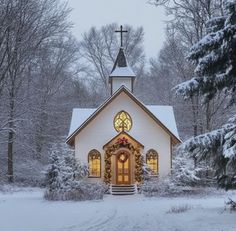 a white church in the middle of winter